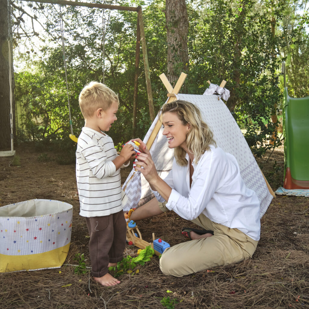 A clinician playing and talking with a young child