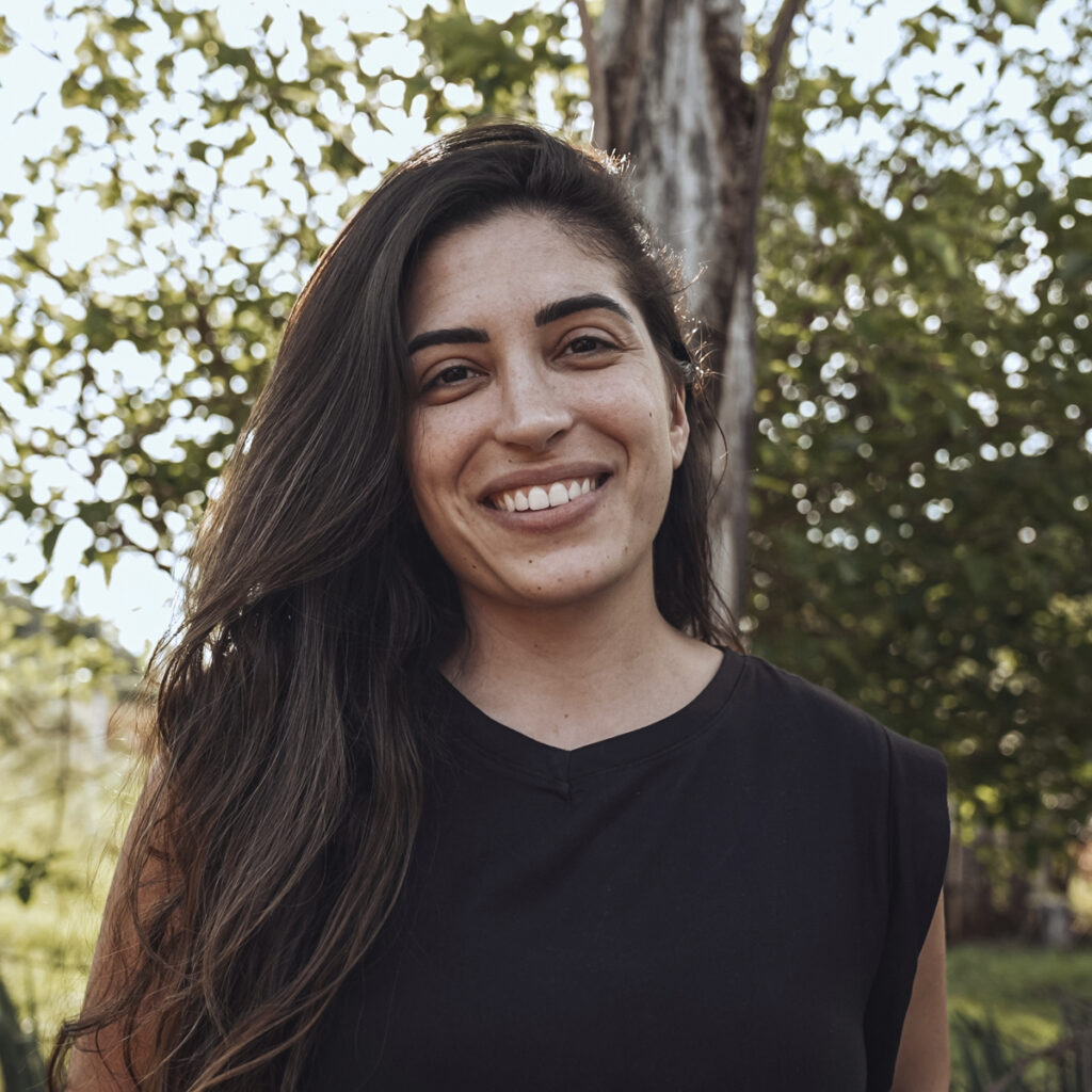 A smiling young woman outdoors