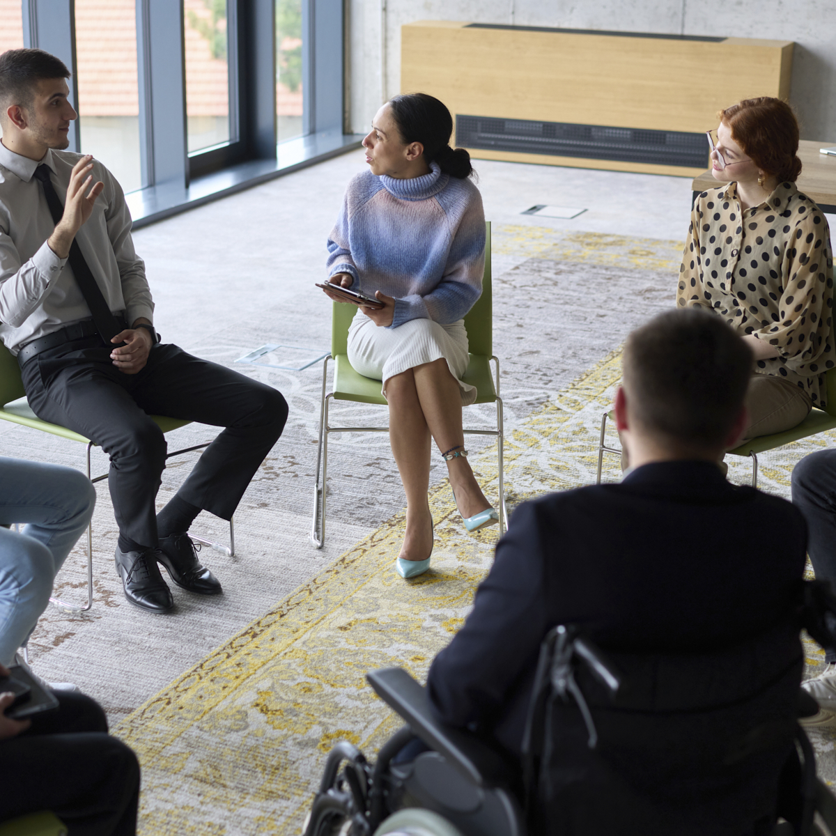 Group meeting including a wheelchair user